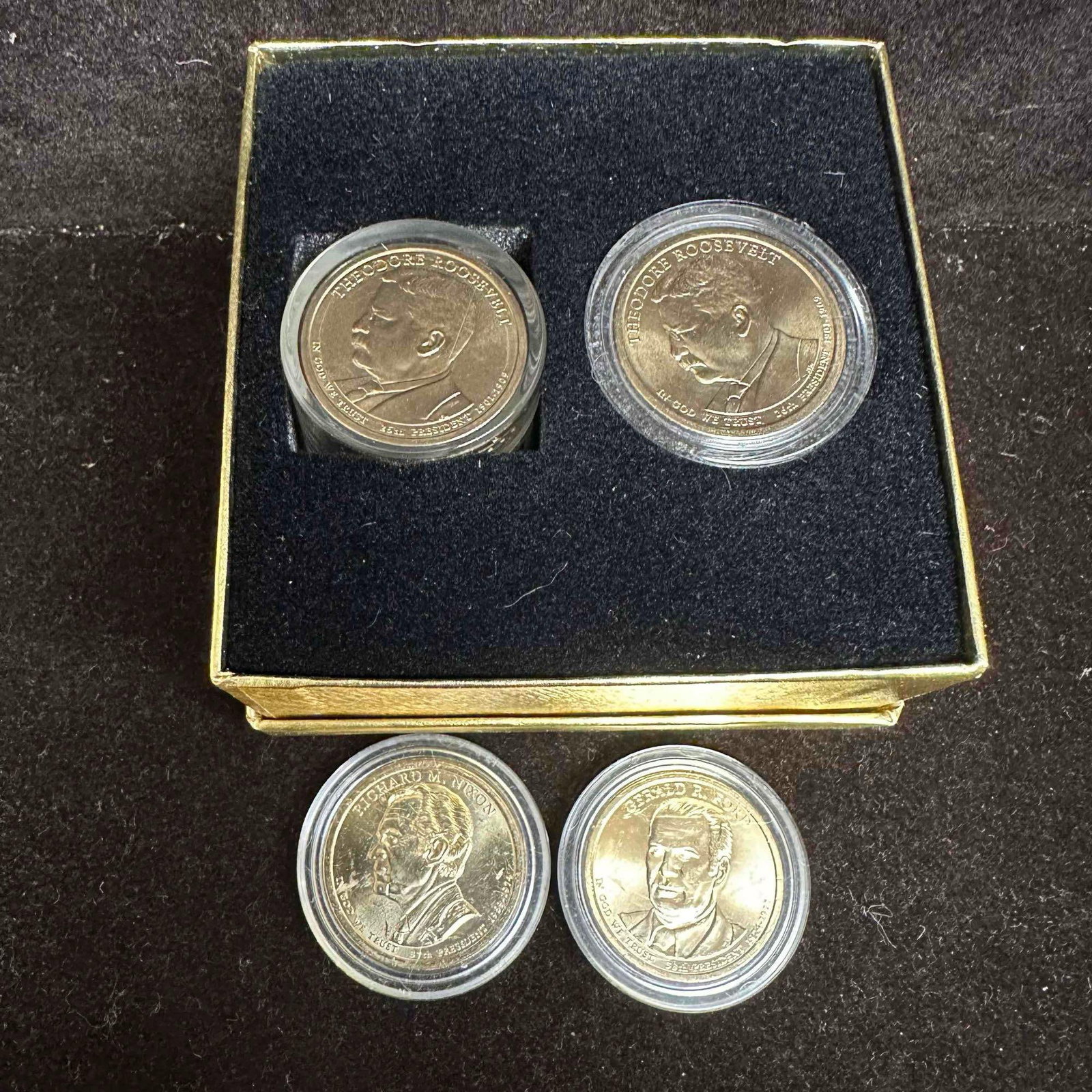 Presidential Dollar Coin Set Uncirculated Roll and Individual Coin Fifteen Dollars: This coin set features uncirculated U.S. Presidential Dollar coins, including a full (12 coin) roll of Theodore Roosevelt and one individual including two loose in coin protector Ford and Nixon coins.
