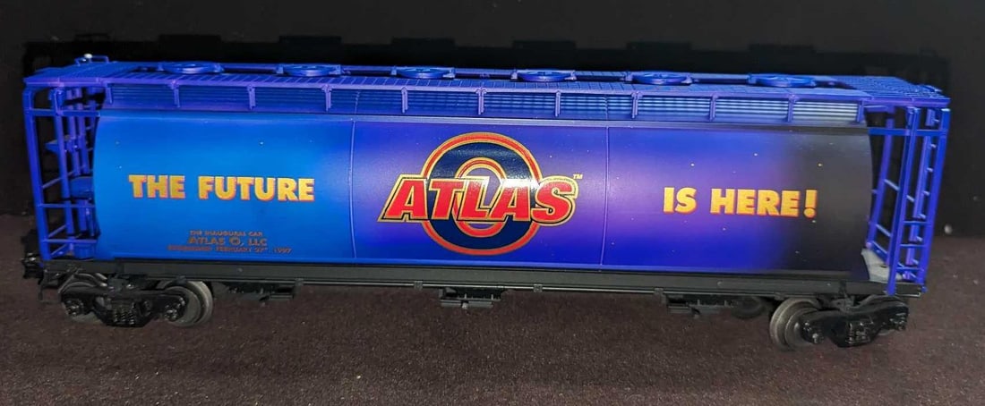 Atlas O Scale Commemorative Cylindrical Covered Hopper Car: Atlas O Scale Commemorative Cylindrical Covered Hopper Car. This was released in 1998. "The Future Is Here!". This is approximately 13" x 3" x 3 3/4".It comes in its original box that is approximately