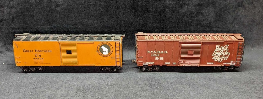 Distressed New York & Great Northern O Scale Boxcars: Distressed New York & Great Northern O Scale Boxcars. This lot includes: (1) Atlas New York, New Haven, And Hartford 17816 Boxcar. This is approx 11 1/2" x 2 1/2" x 3 1/2". The boxcar 