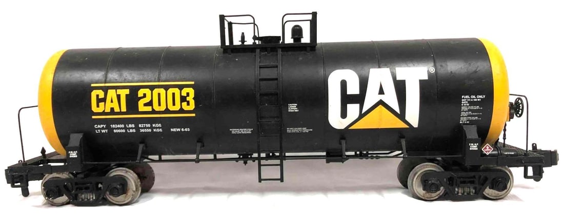 Unibody Tank Car- CAT 2003: This lot contains a uni body tank car with the road name CAT 2003. This tank car has a detailed polycarbonate body, metal wheels/axles and decorative brake wheels. The tank car is approx 18 1/2" x 4" 