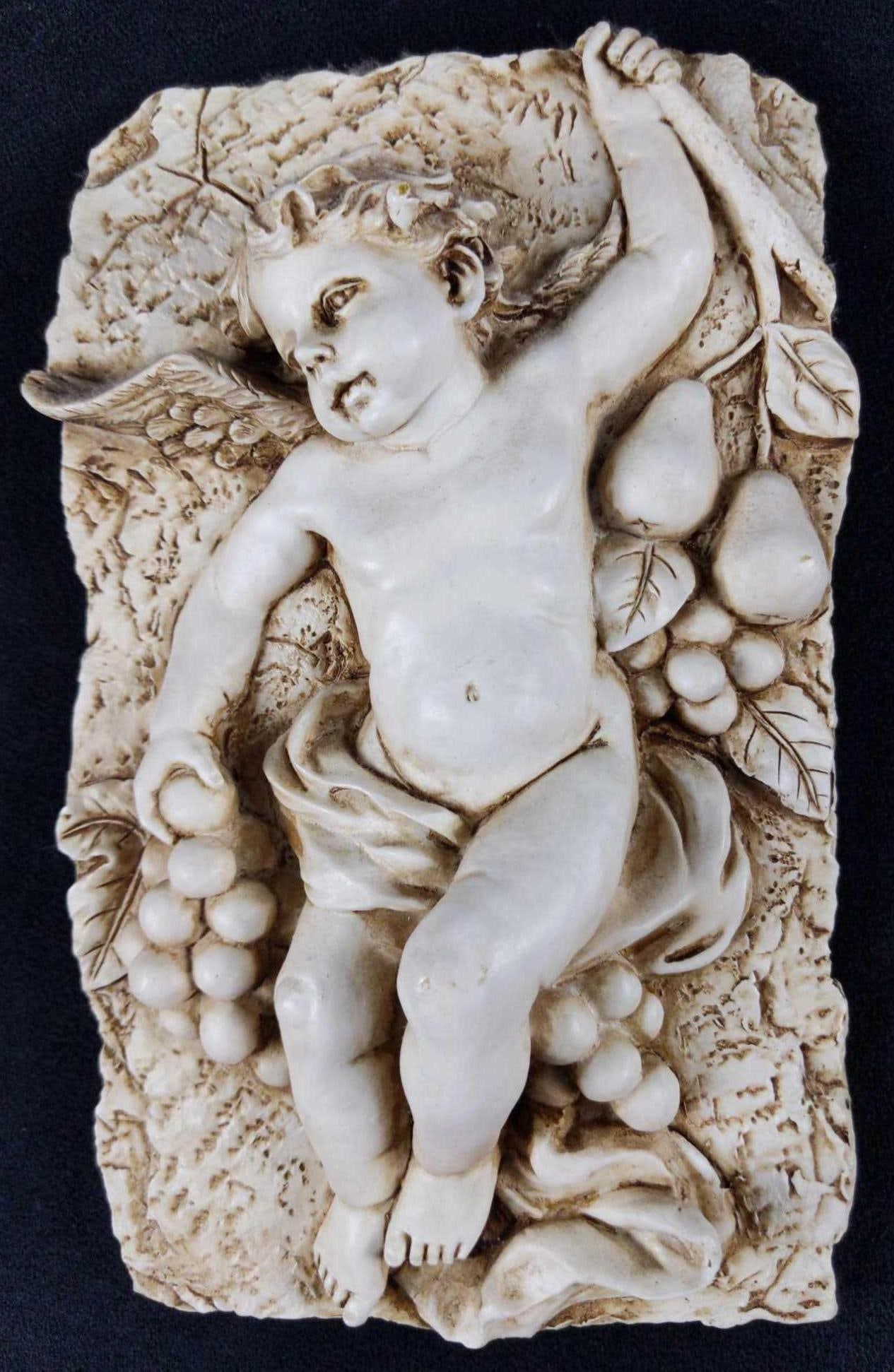 Vintage Style Cherub White Hard Resin Relief: Vintage Style Cherub Hard White Resin Relief. Need somebody to watch over your wine? Here's one of Bacchus' (god of wine) little cherubs who can do the job! Hangable relief is made of 
