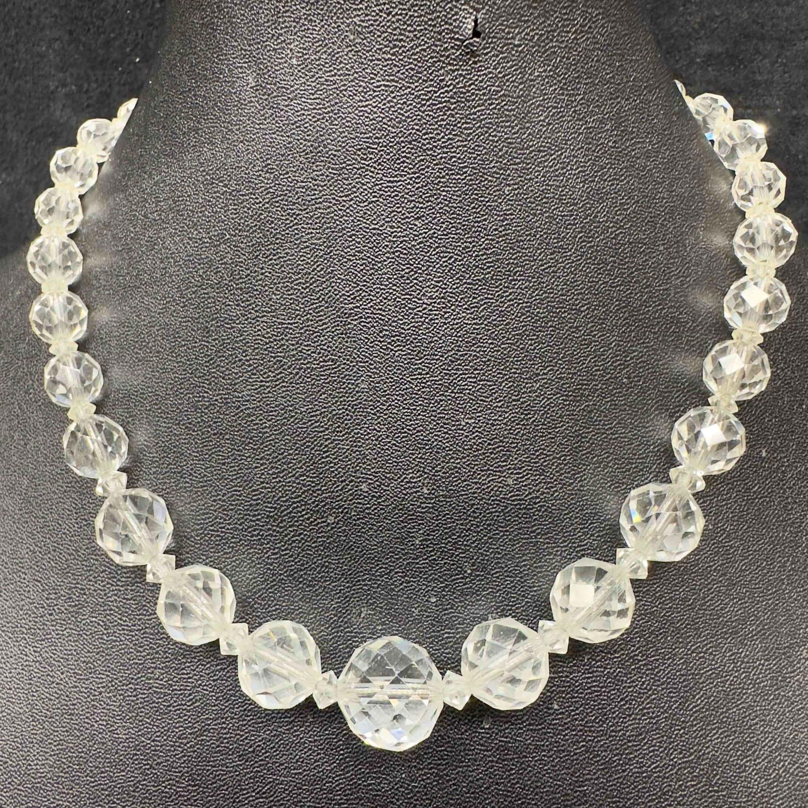 Clear Crystal Art Glass Round Faceted Beaded Costume Jewelry Necklace G93: Clear Crystal Art Glass Round Faceted Beaded Costume Jewelry Necklace G93. Necklace clear glass beads with beautifully shaped designs on each. The necklace features a j hook clasp closure. This item i