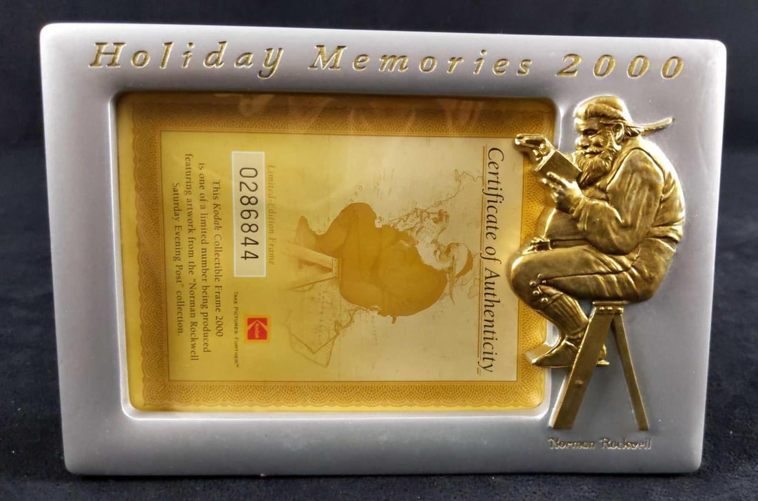 Kodak Christmas LE Santa Norman Rockwell Frame: Kodak Christmas LE Santa Norman Rockwell Frame. Holiday Memories 2000 by Kodak Collectible Frames. This is a limited edition frame. #286844. This features Santa Claus by Norman Rockwell. Package is ap