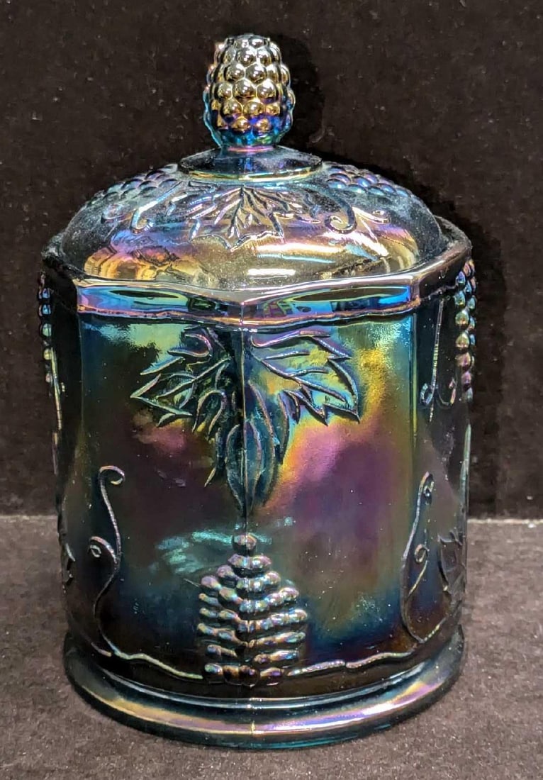 Vintage Iridescent Carnival Harvest Grapes Glass Jar With Lid: Vintage Iridescent Carnival Harvest Grapes Glass Jar With Lid. This is approx 4 1/2" x 4 1/2" x 7" and it weighs 2.69lbs. The jar has no cracks or chips. The bottom has some signs of wear and some imp