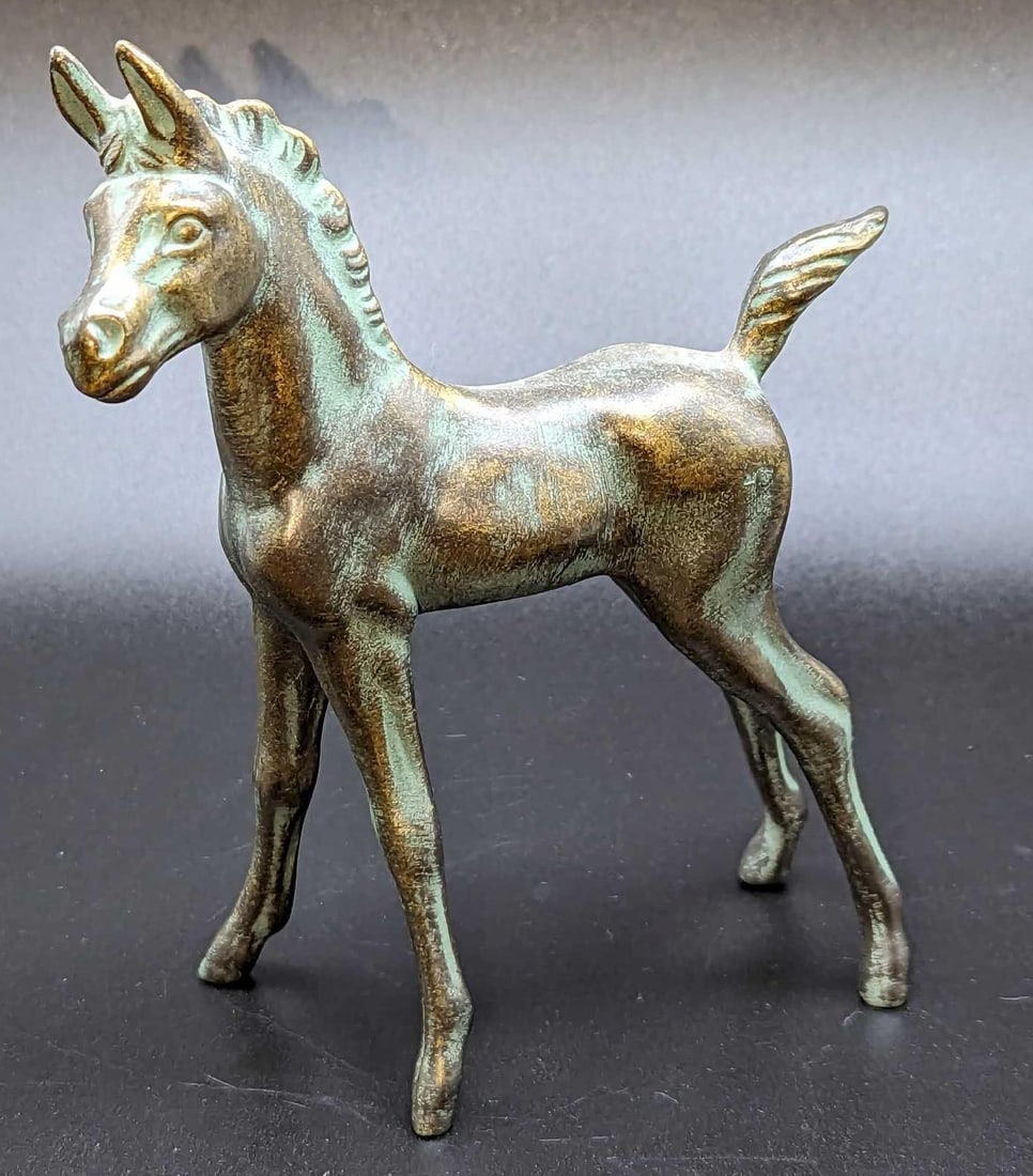 Rare Bronze Tone Goebel Foal Horse Figurine: Rare Bronze Tone Goebel Foal Horse Figurine. This is approx 5" x 2 1/2" x 6" and it weighs 0.24lb. The ceramic figurine has no chips or cracks.
