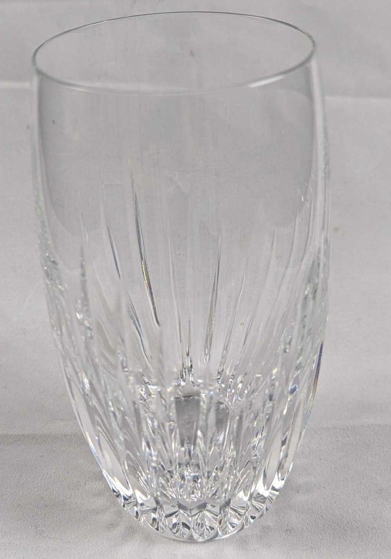 Baccarat Crystal Massena Highball Glass: The intricate detailing gives the Massena highball a barrel-like appearance and a textural feel. This artful handiwork puts the upper smoothness of the glass in sharp relief. The polished silhouette a