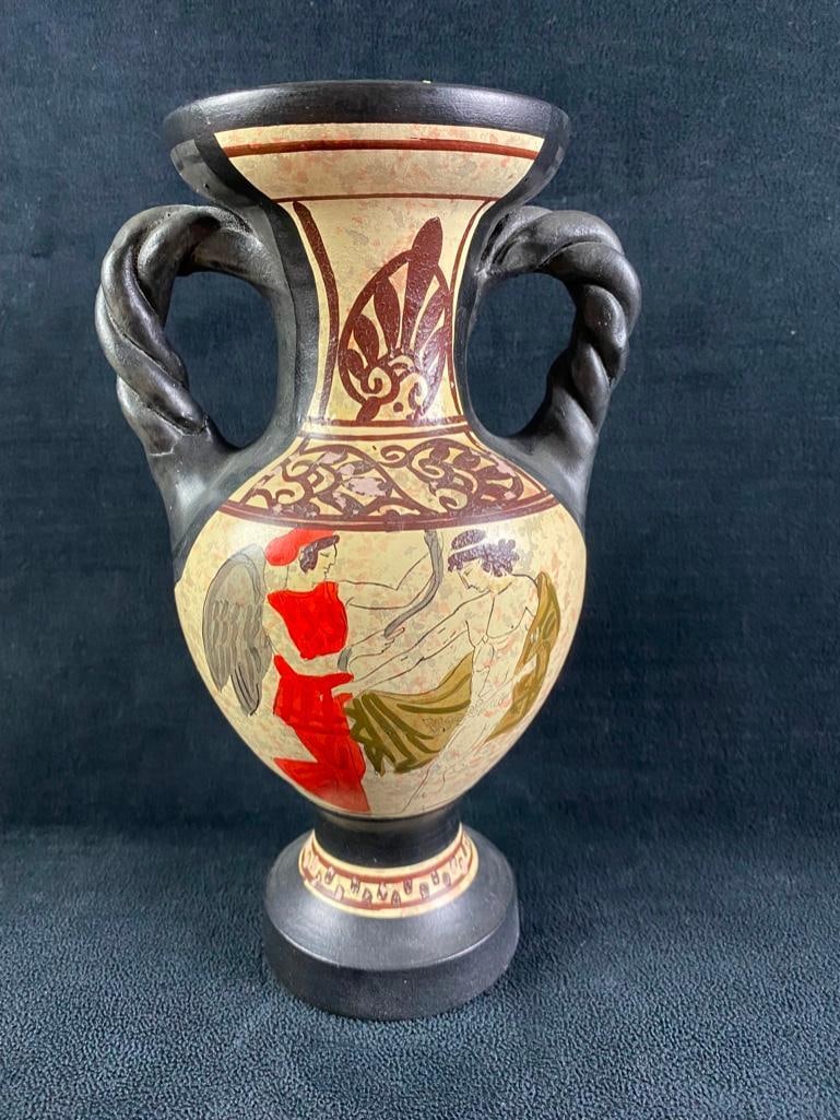 Vintage Greek Souvenir Amphora Jug: Vintage Greek Souvenir Amphora Jug Ceramic amphora jug, made in Greece. The jug features hand-painted designs inspired by ancient Grecian pottery. The bottom of the jug is marked "Made in Greece&