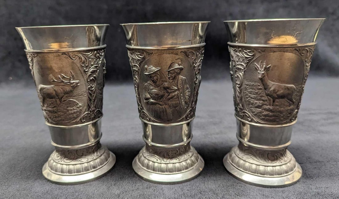 3 Vintage German Zinn Becker Pewter Wine Cups: 3 Vintage German Zinn Becker Pewter Wine Cups. Each wine cup is approx 3" x 3" x 5 1/2" and together they weigh 2.36 lbs. The wine cups are in good, vintage condition with some light scratches and the