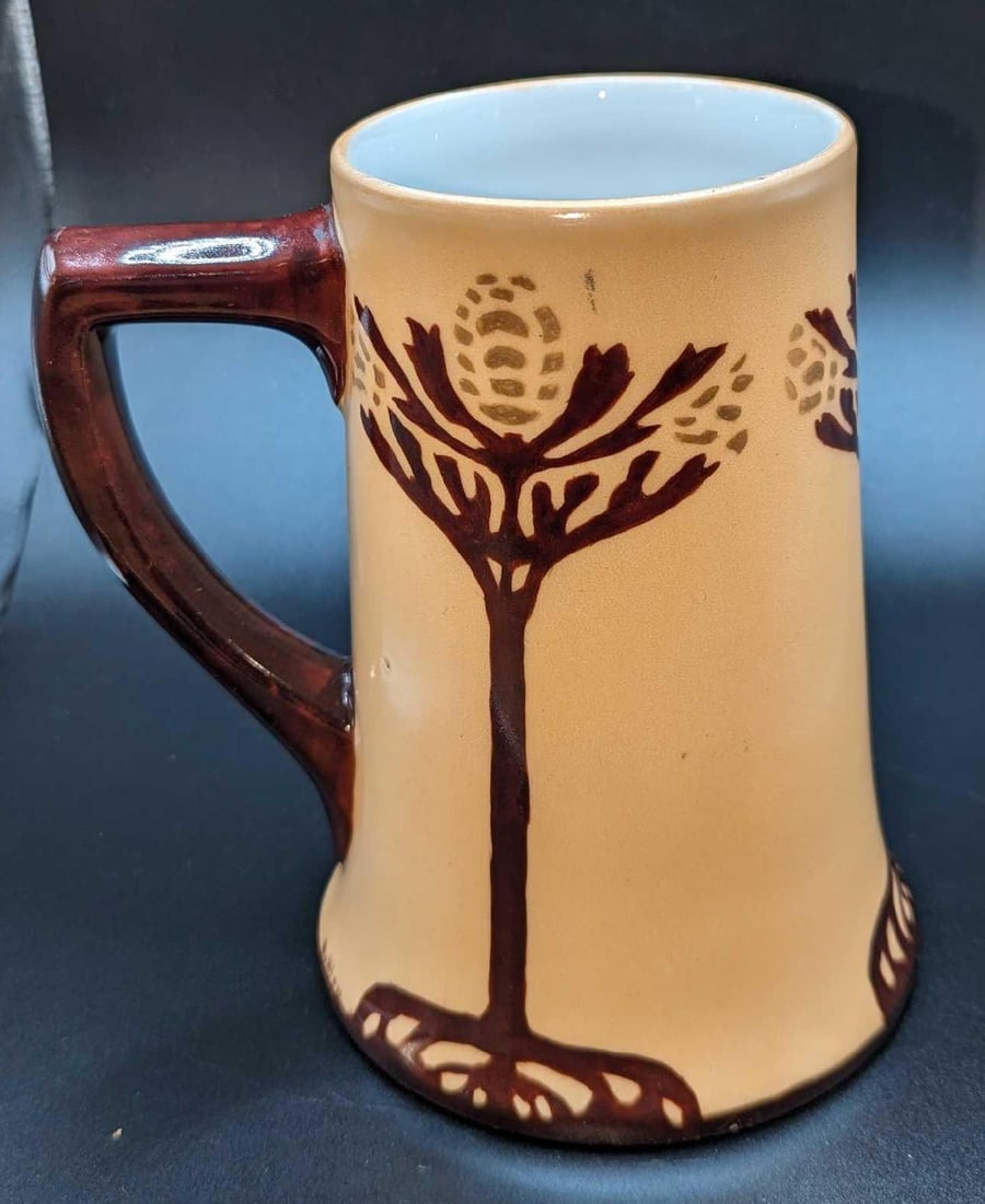 Vintage Limoges Bell Shaped Ceramic Stein: Vintage Limoges Bell Shaped Ceramic Stein. This stein is approximately 5 1/4" x 4" x 5 3/4" and it weighs 1.14lb. The stein has some light signs of wear.