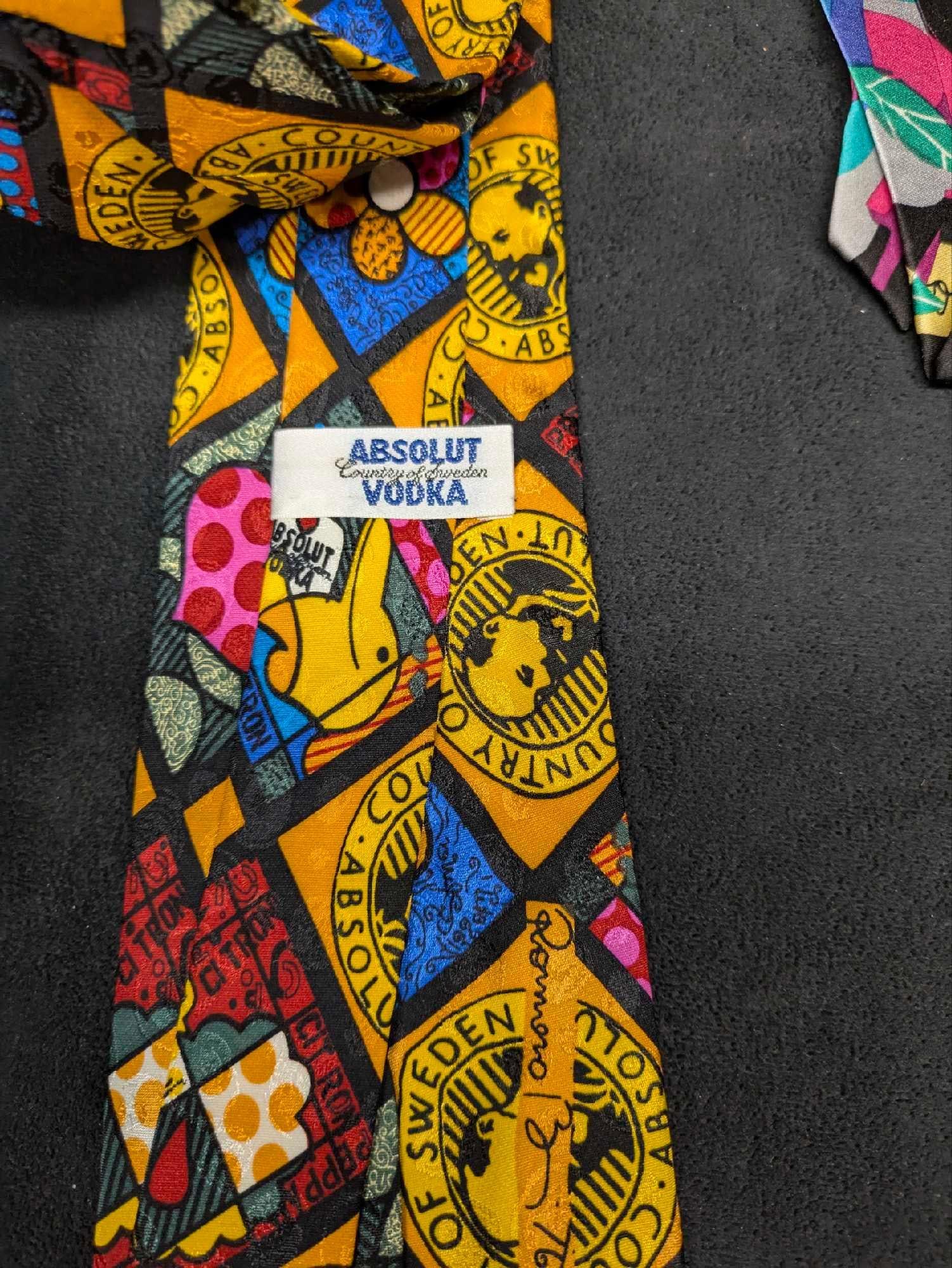 Absolut Vodka Romero Britto And Marcia G. Yerman Silk Ties: Absolut Vodka Romero Britto And Marcia G. Yerman Silk Ties. Rare ties come NIB. The packages are approx 16 1/2" x 4 1/2" and the total weight is 0.30lb. The Yerman package has some creases, bu