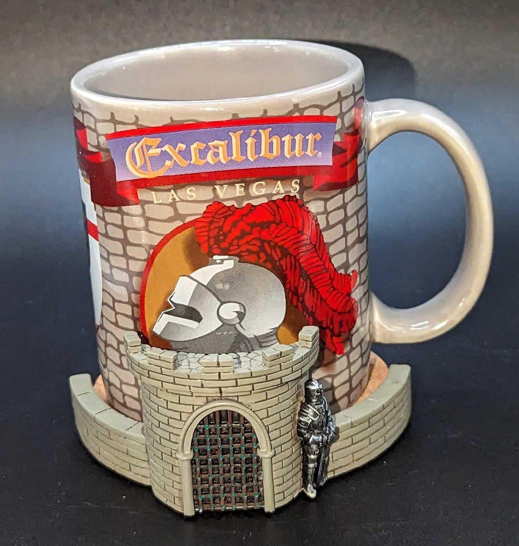 Excalibur Las Vegas Coffee Mug With Castle Coaster A: Excalibur Las Vegas Coffee Mug With Castle Coaster A. The ceramic mug is 5" x 3" x 3 3/4". The resin castle coaster is approx 4" x 3 3/4" x 1 3/4". The total weight is 1.05lb. The mug and coaster have