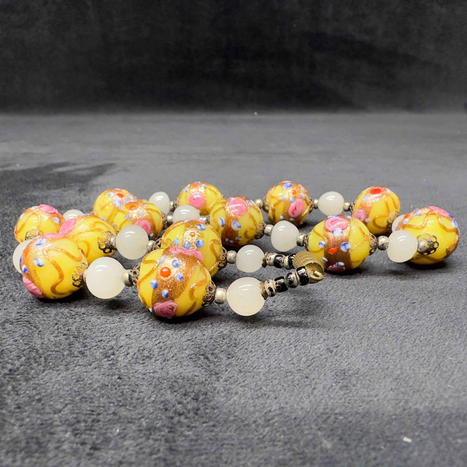 Venetian Murano Lamp Work Glass Yellow Round Bead Fiorato Floral Beaded Copper Accents Necklace A93: Venetian Murano Lamp Work Glass Yellow Round Bead Fiorato Floral Beaded Copper Accents Necklace A93. Necklace with yellow glass beads with beautiful designs on each. The necklace features copper and f