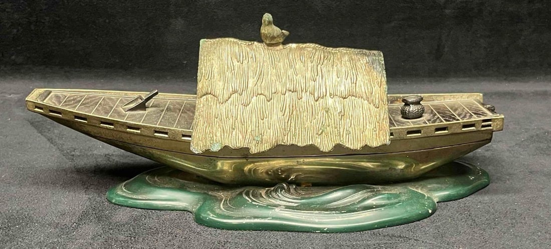 Unique Storage Metal Boat Sculpture: This lot contains a Unique Storage Metal Boat Sculpture. It is approx 10 1/2" x 4" x 4". Total weight is approx 1.2lbs. Overall the Unique storage boat sculpture is in good pre owned condition with so