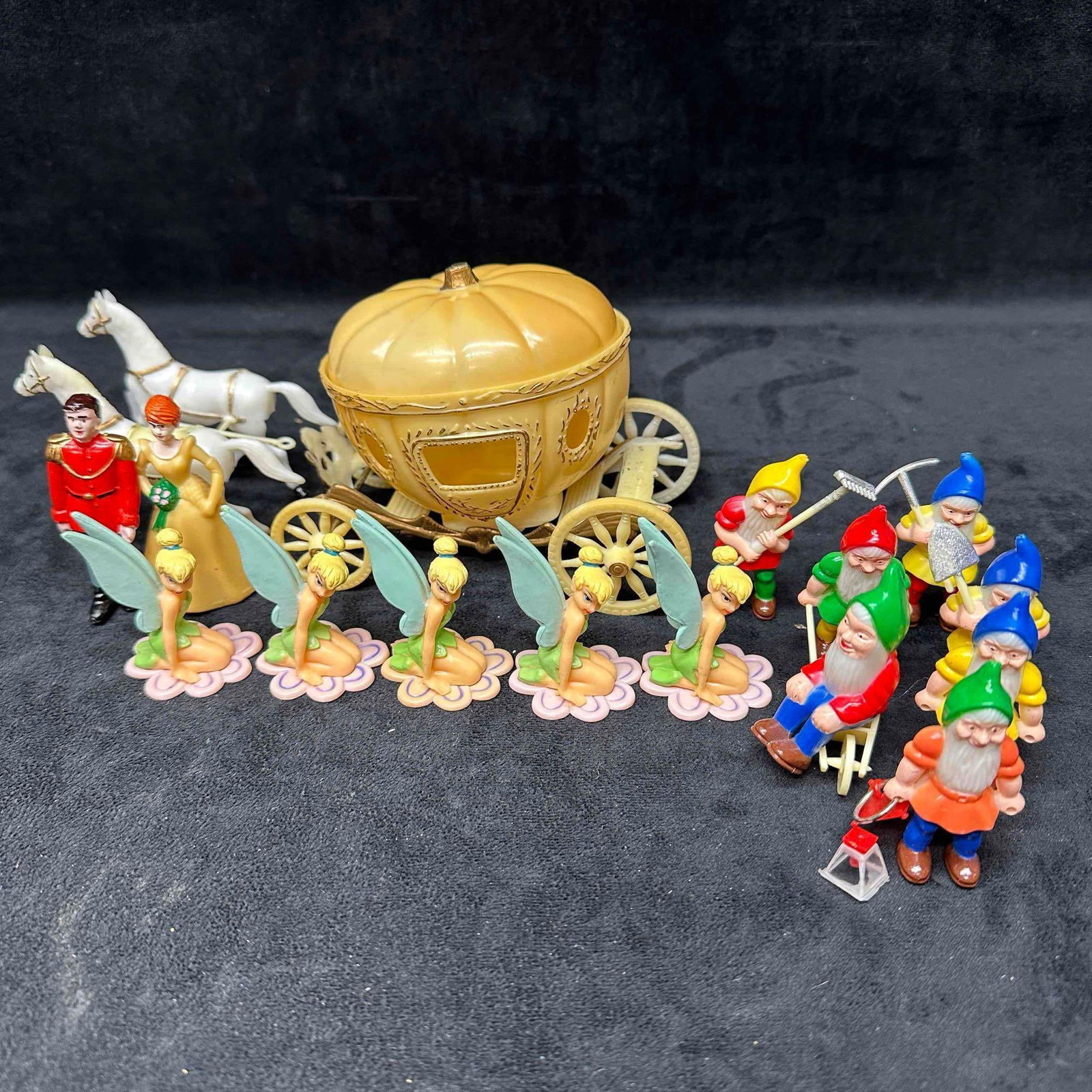 Disney Cake Topper Cinderella Snow White Dwarfs and Tinkerbell Set: This set includes vintage Disney cake toppers representing Cinderella, Snow White Dwarfs, and Tinkerbell. These items are in good pre-owned, previously displayed condition with light wear, and surface