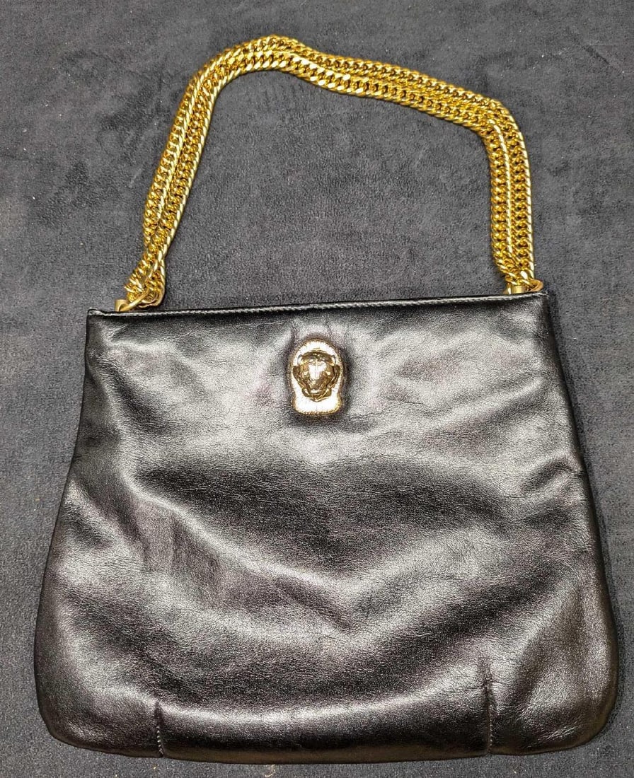 Ruth Saltz Leather Double Chain Strap Handbag: Ruth Saltz Leather Double Chain Strap Handbag. This is approx 10" x 3/4" x 8" and it weighs 1lb. The handbag has some light signs of wear and scratches along with some wear on the cougar's head. 