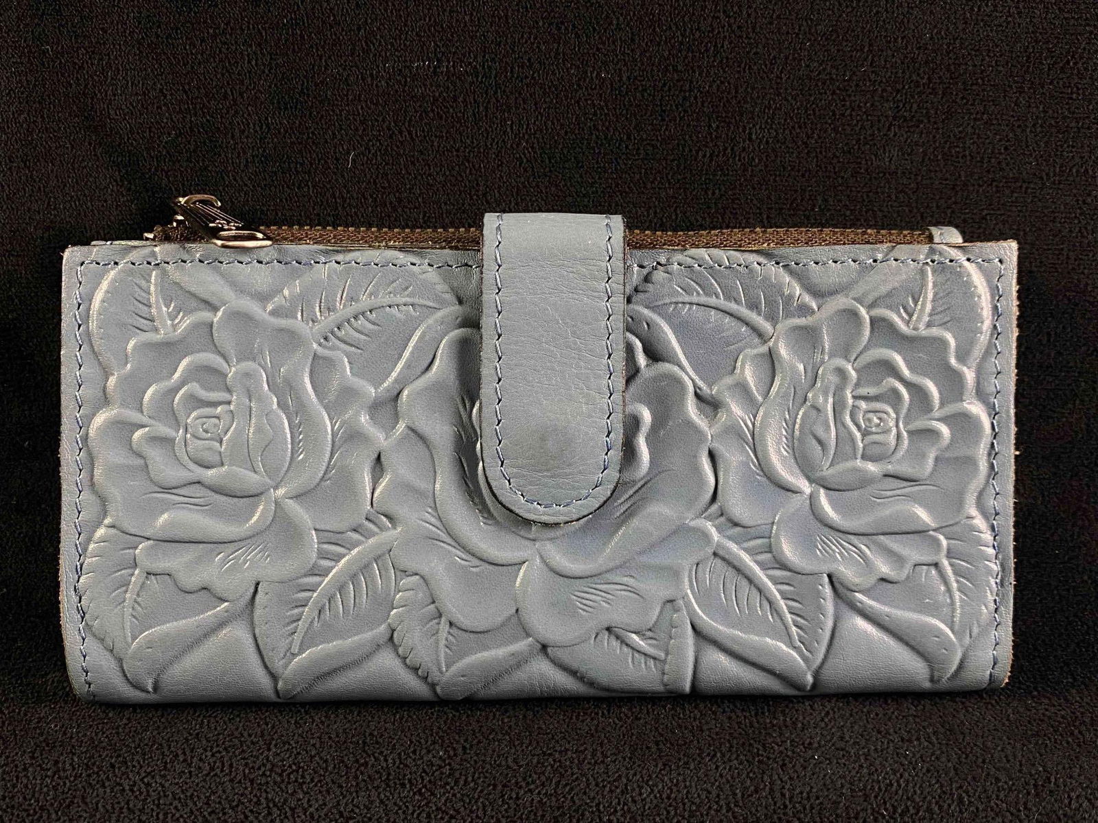 Patricia Nash Tooled Leather Rose Wallet in Blue: Patricia Nash Tooled Leather Rose Wallet in Blue Tooled leather wallet in blue, by Patricia Nash. In good condition with no known damage. Has card slots, an ID holder, and a zipper pocket for coins