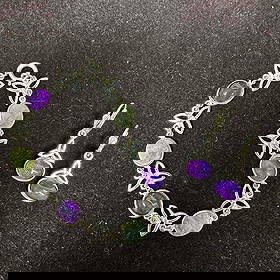 Sterling Silver 925 Bracelet and Earrings Set Amethyst and Green Gemstones Celtic Knot Design: This item is in good pre-owned, previously used/displayed condition with noticeable light wear, and surface scratches. Please reference all photos for full details. This piece of jewelry has been test