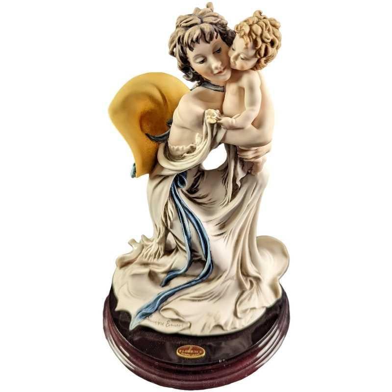 Giuseppe Armani Baby Mine Statue: Giuseppe Armani Baby Mine Statue Open Edition Baby Mine" Giuseppe Armani Statue. The figurine is made of Capodimonte porcelain and is approx 6" x 6" x 9 1/2" and it weighs 2.03lbs. Th