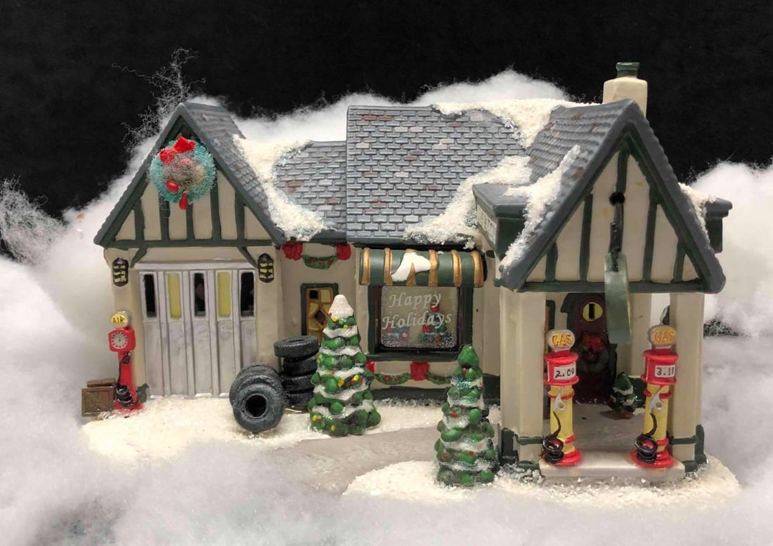 Village Gas Station The Village Collection By St.Nicholas Square: This lot contains the Village Gas Station The Village Collection By St.Nicholas Square. The gas station comes in its original packaging. The box is approx 12" x 9 1/4" x 8 1/4" while the gas station i