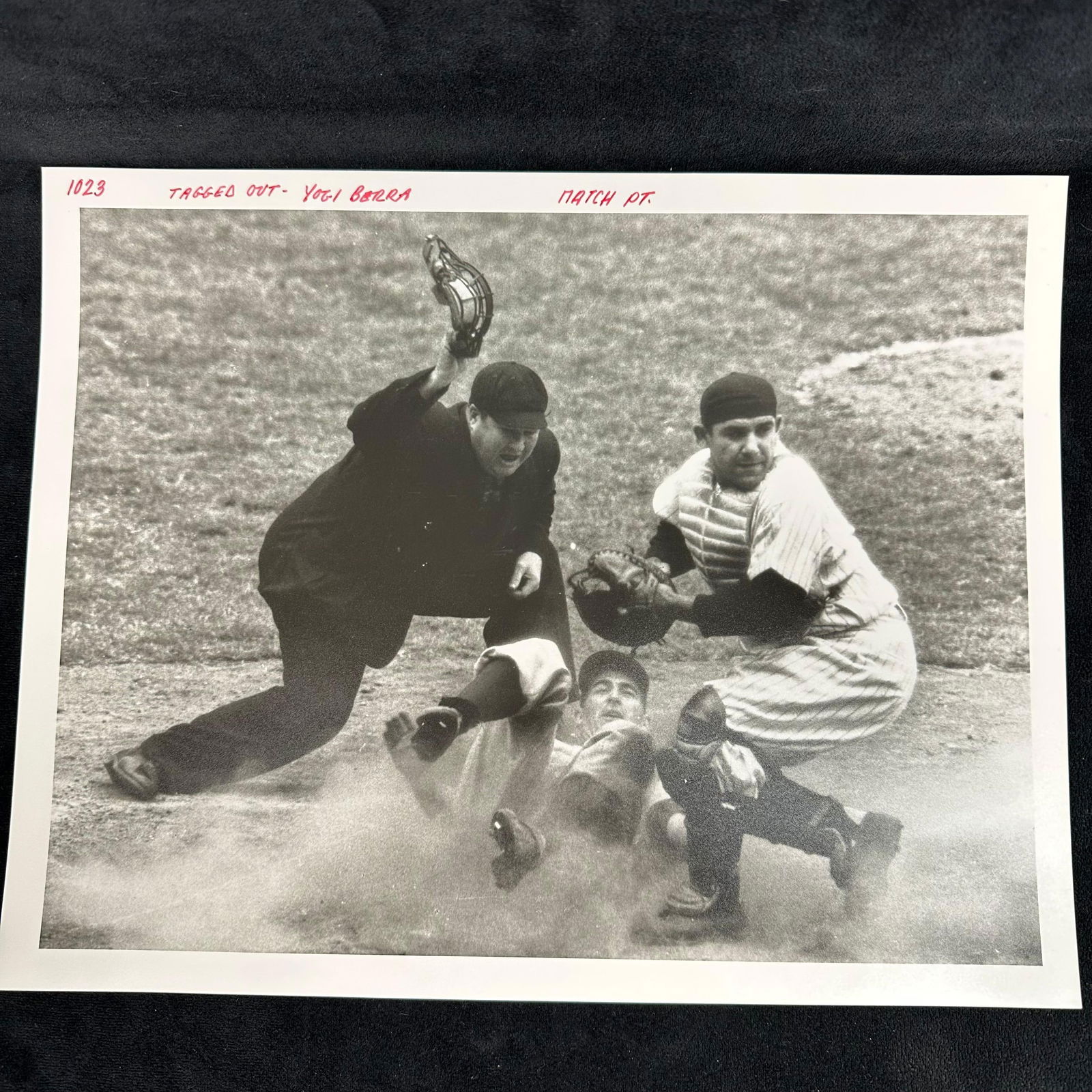 Yogi Berra Tagged Out Black and White Analog Photograph Print: Black-and-white analog photograph printed on pearl resin-coated photo paper, capturing Hall of Fame catcher Yogi Berra in action as he tags out a runner at home plate, with the umpire signaling the pl
