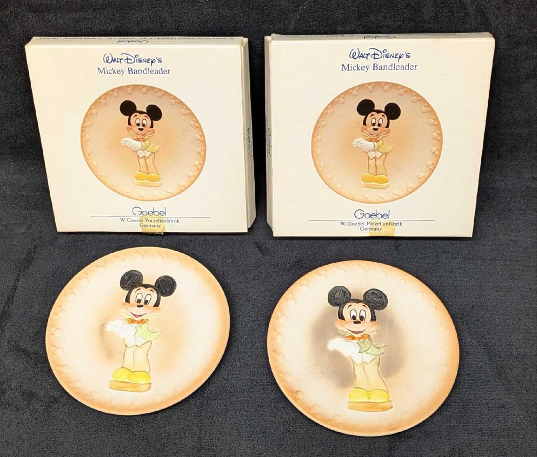 2 Goebel Disney Handpainted Mickey Mouse Collector Mini Plates: 2 Goebel Disney Handpainted Mickey Mouse Collector Mini Plates. Both come in the original box that is approx 1/2" x 4 3/4 "x 4 3/4". The total weight is 0.58lb. The boxes have shelf wear and tape.&nbs