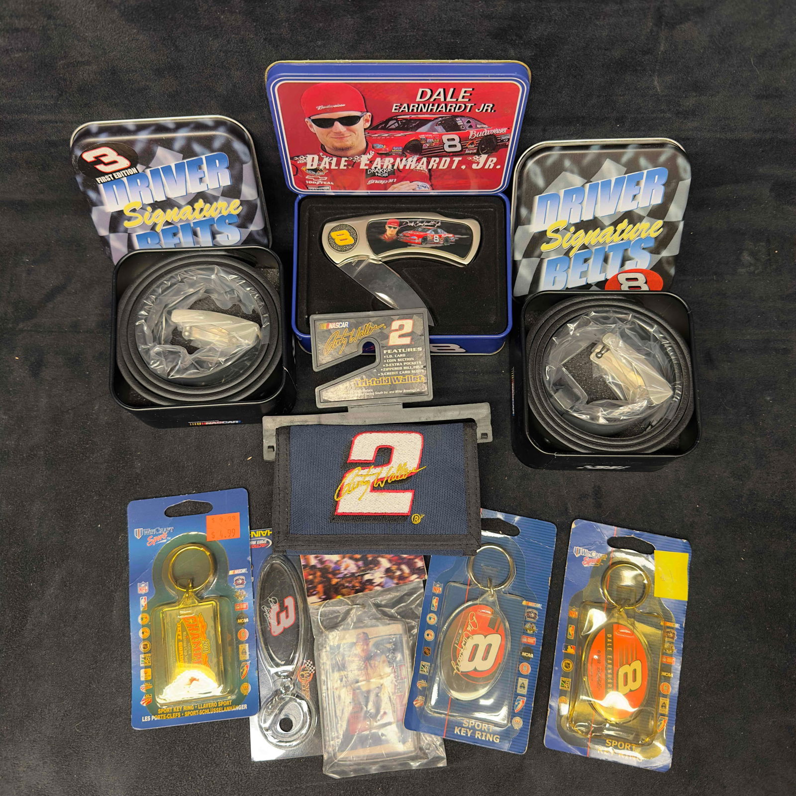 NASCAR Dale Earnhardt Sr. and Jr. Collectibles Various Keychains Belts Wallet Set 9 Pocket Knife: NASCAR Dale Earnhardt Sr. and Jr. Collectibles Various Keychains Belts Wallet Set 9 Pocket Knife. Various NASCAR collectibles featuring Earnhardt Sr. and Jr. and other drivers. The collection includes