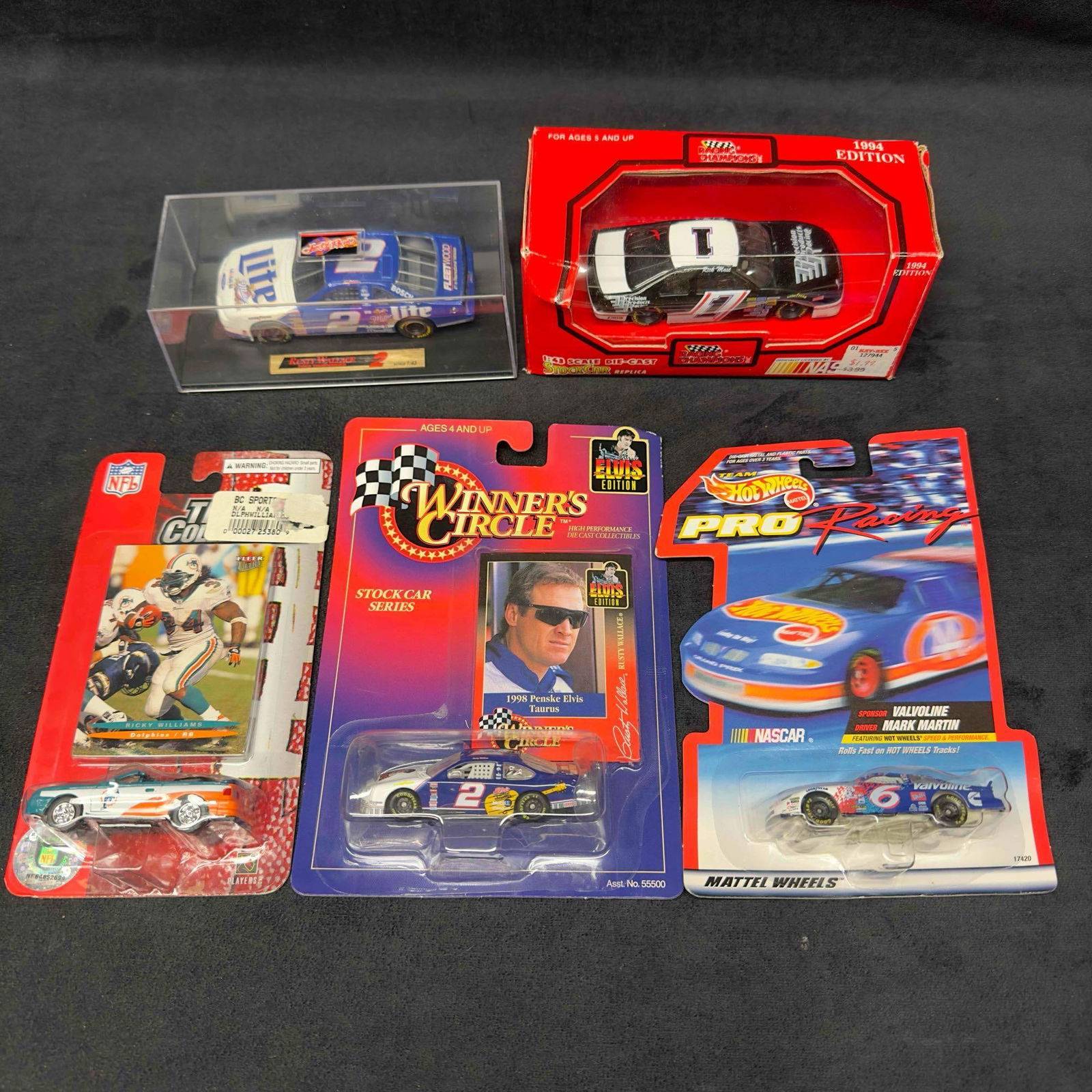 NASCAR NFL Racing Die Cast Collectibles Toy Cars Hot Wheels Lot of Five: NASCAR NFL Die Cast Collectibles Lot of Five (5). One car features a Miami Dolphins player Ricky Williams card. Three of the items are in brand new condition, while two of the diecast cars are in used