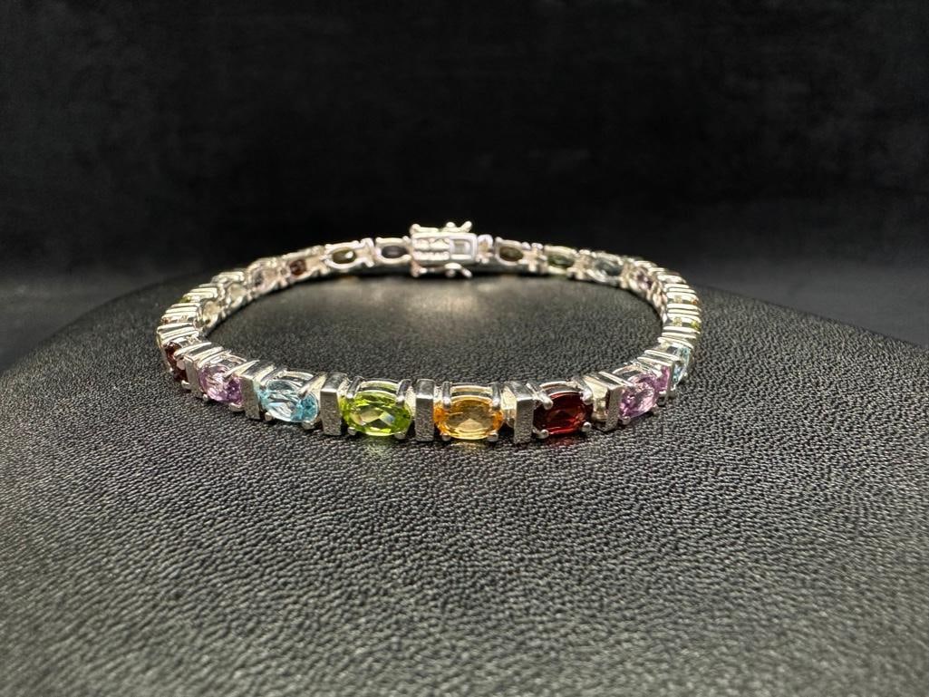 Sterling Multi-Stone Bar Set Bracelet: This piece of jewelry has been tested and researched prior to listing. Please view all our pictures they are part of our description. DETAILS: Metal - Sterling Silver Color - Silver Stones - none Hall