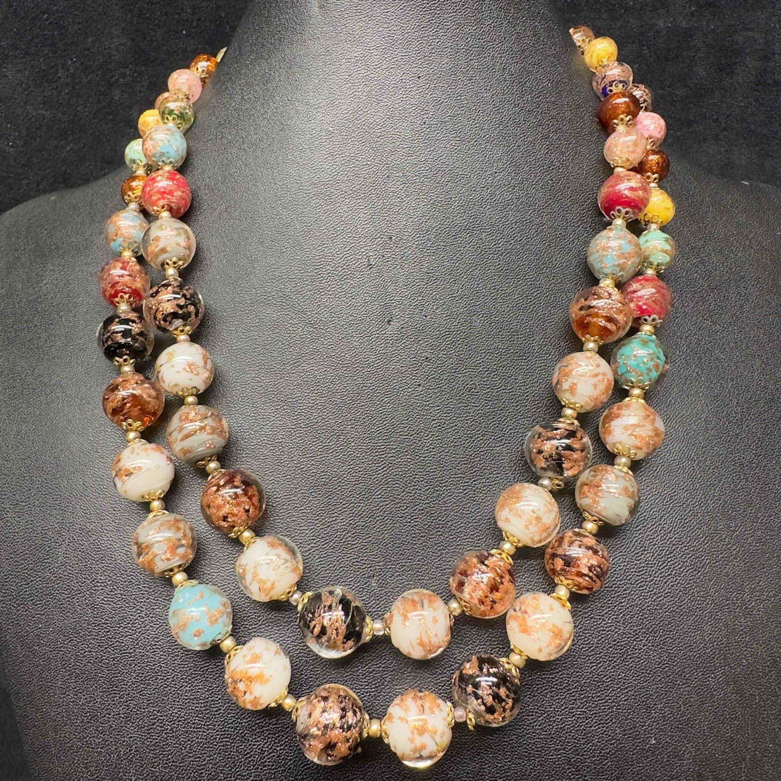 Murano Venetian Art Glass Lamp Work Multi Colored Double Layer Beaded Necklace C65: Murano Venetian Art Glass Lamp Work Multi Colored Double Layer Beaded Necklace C65. Necklace with multi colored glass beads with beautiful designs on each. The necklace has two layers of beads with a