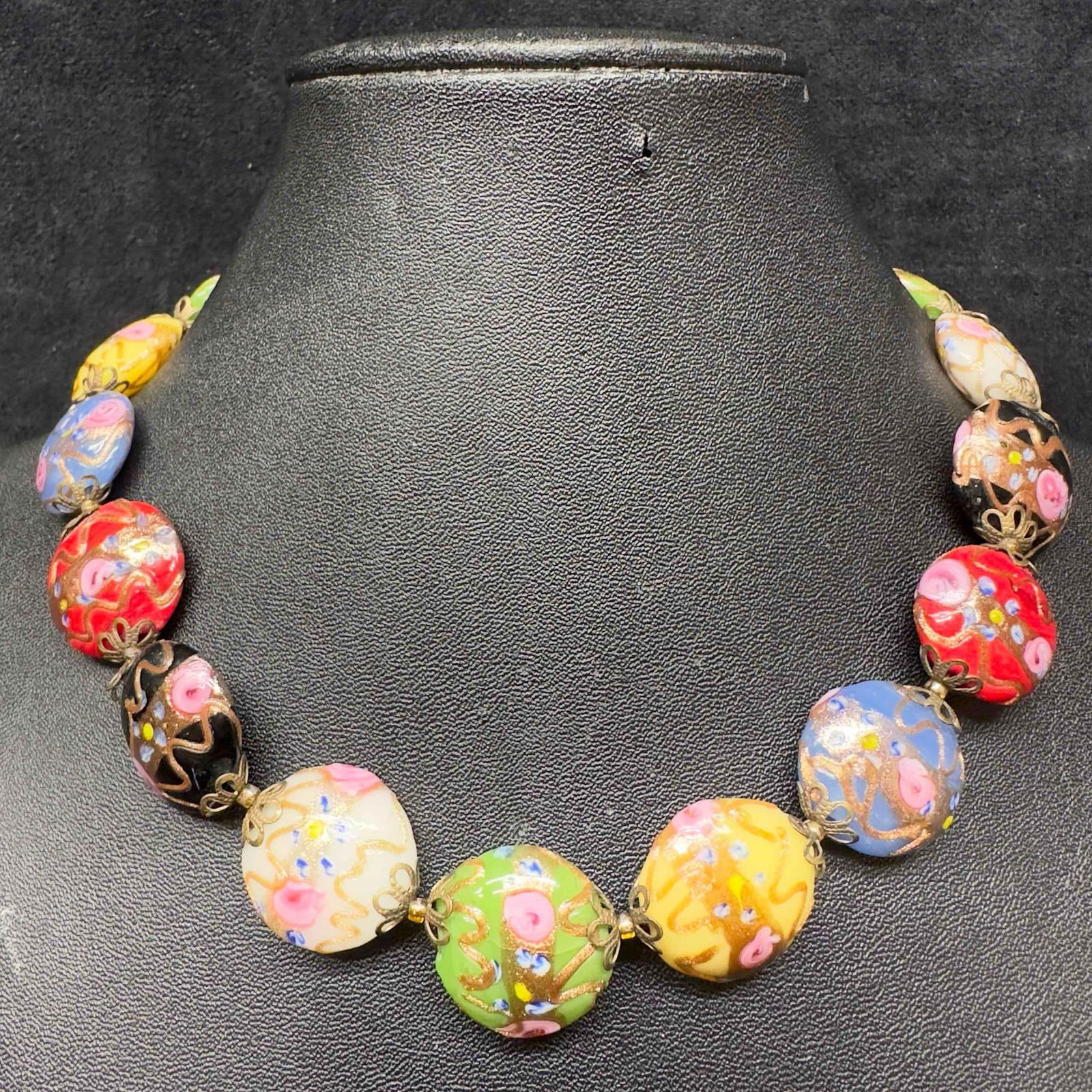 Murano Venetian Art Glass Lamp Work Multi Colored Circle Bead Floral Fiorato Beaded Necklace C57: Murano Venetian Art Glass Lamp Work Multi Colored Circle Bead Floral Fiorato Beaded Necklace C57. Necklace with multi colored glass beads with beautiful floral designs on each. The necklace features c