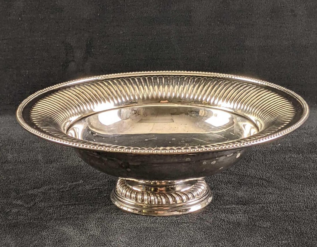 William Adams Silver Plated Pedestal Bowl: This is in good condition with little tarnish. There are scratches inside the bowl. This bowl is marked with the William Adams makers mark. weight: 2lbs 9.75in diameter