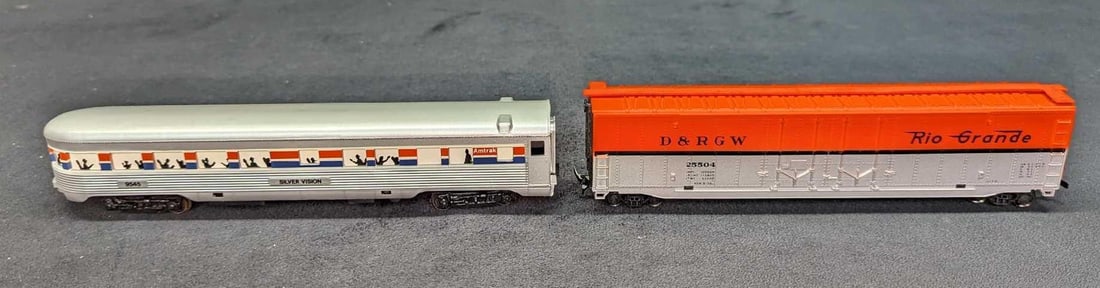 Amtrack Observation Car & Rio Grande Box Car: Amtrack Observation Car & Rio Grande Box Car. This lot includes: (1)Life-Like Lighted Amtrak Observation Car. This comes in its original box that is approximately 9 3/4" x 3 1/4" x 1 1/2&#