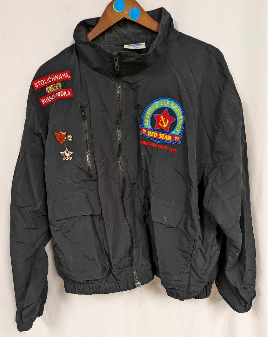 Men's XL Red Star Leningrad Yacht Club Jacket: Men's XL Red Star Leningrad Yacht Club Jacket. It also has three pins attached to the left side and is marked with a Stolichnaya Vodka patch. This is approx 18"x 3" x 28" and it weighs