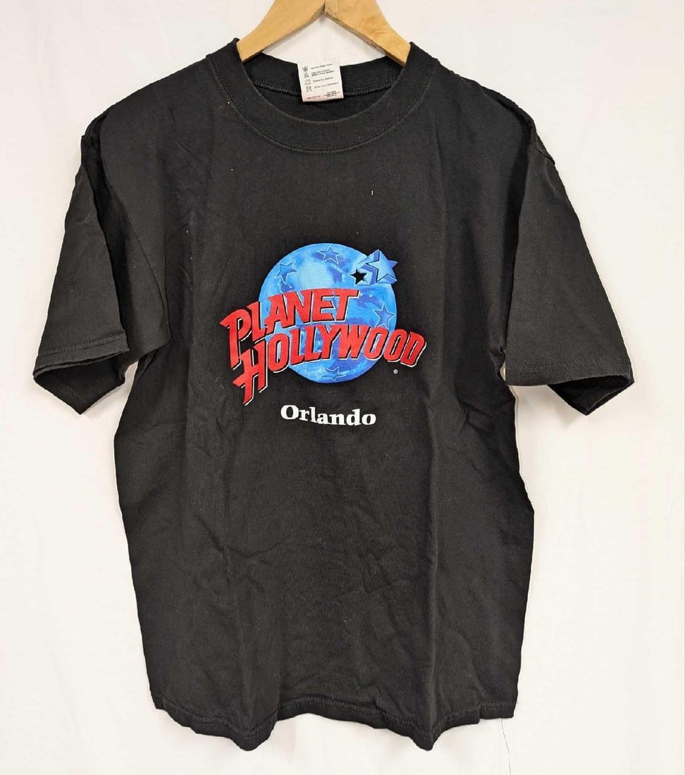 Adult Medium Planet Hollywood And Disney 2000 Celebration: Adult Medium Planet Hollywood And Disney 2000 Celebration. This lot includes two adult medium shirts that are 100% cotton. Folded together, the shirts are approx 10" x 7" x 4" and it weighs 1lb. The s