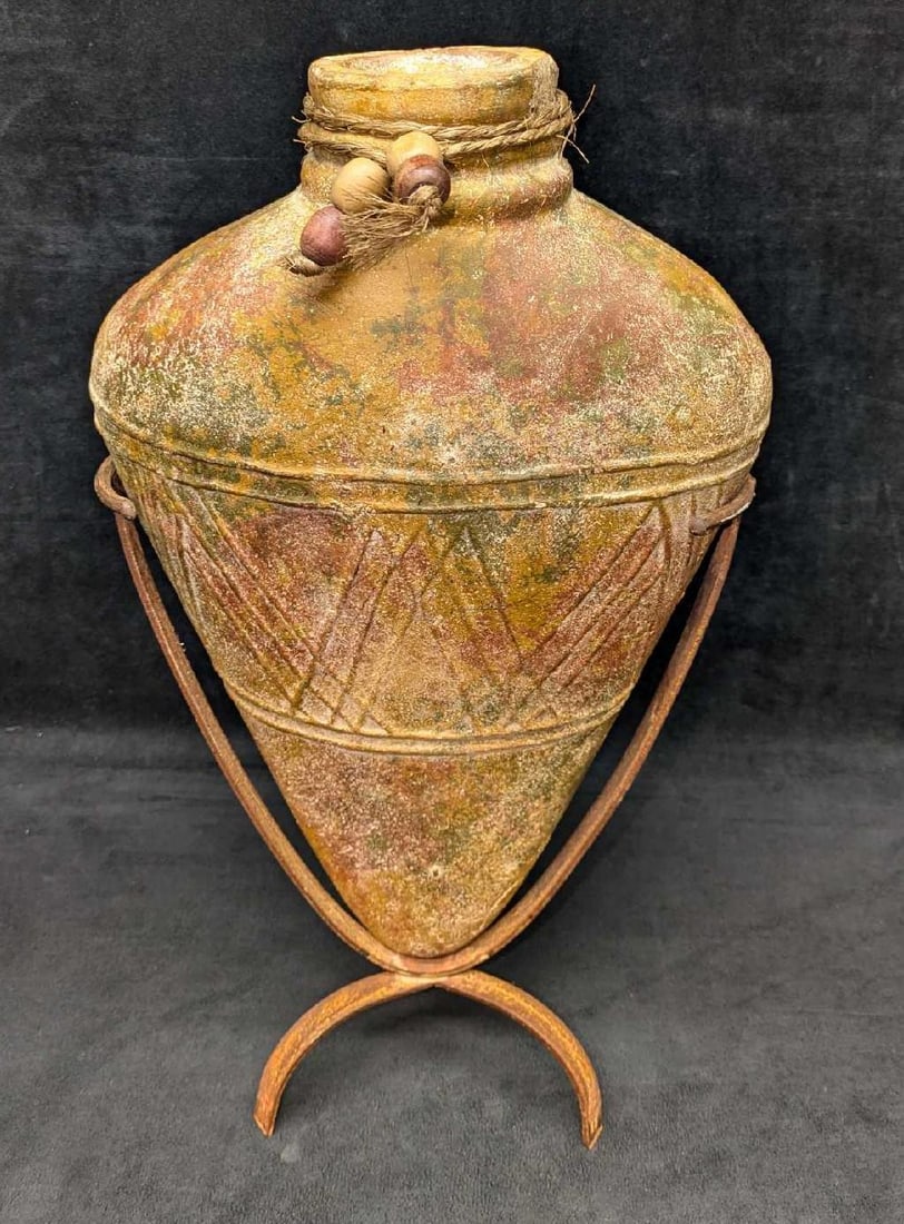 Vintage Amphora Pottery Vase With Metal Stand: Vintage Amphora Pottery Vase With Metal Stand. The vase is approx 10" x 4" x 15 1/2". The metal stand is approx 9" x 5" x 11 3/4" and the total weight is 6.80lbs. There is some light surface rus