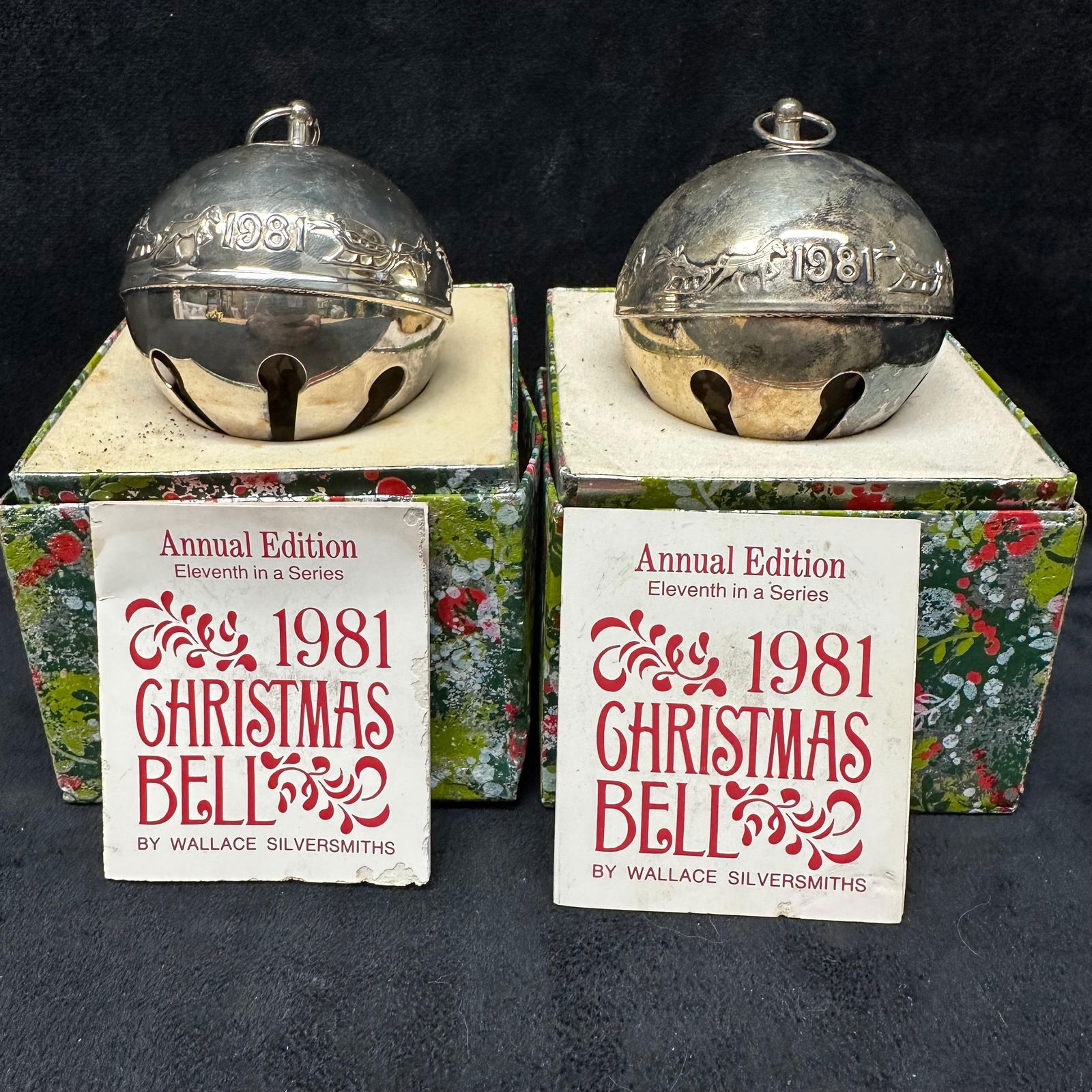 Pair of 1981 Wallace Silversmiths Annual Christmas Bells Eleventh Edition with Boxes: Set of two 1981 Wallace Silversmiths Annual Christmas Bells, the 11th edition in this collectible holiday series. Each silver-plated bell features a raised horse and sleigh design with “1981”