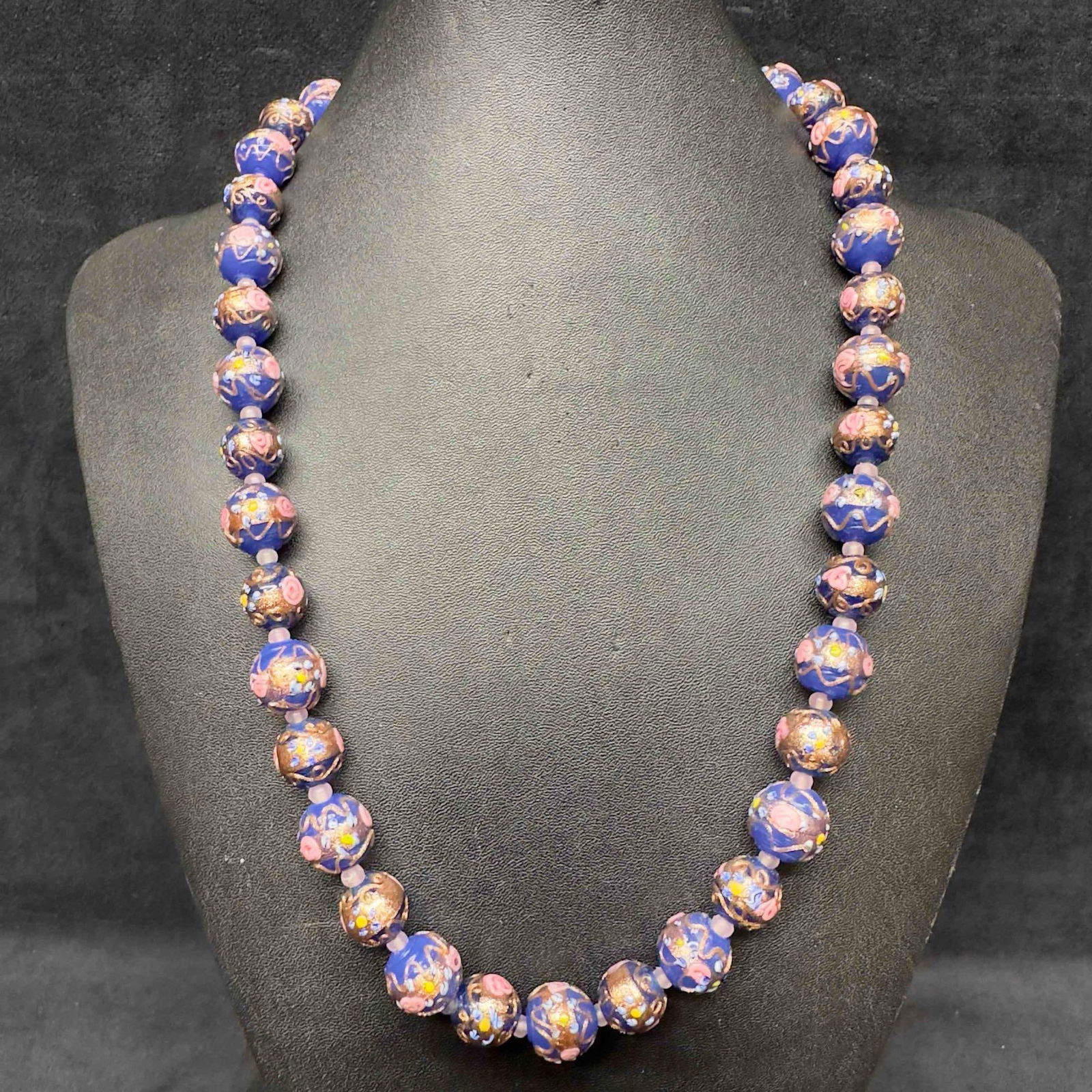 Venetian Murano Lamp Work Art Glass Round Bead Dark Blue Beaded Floral Fiorato Long Necklace D25: Venetian Murano Lamp Work Art Glass Round Bead Dark Blue Beaded Floral Fiorato Long Necklace D25. Necklace with dark blue colored glass beads with beautiful designs on each. The necklace features flor