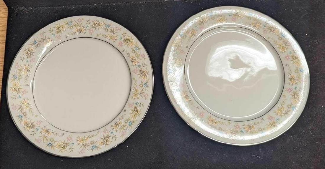 2 Retired Noritake Blossom Time Dinner Plates E: 2 Retired Noritake Blossom Time Dinner Plates E. Each plate is approx 10 3/8" x 10 3/8" x 7/8" and the total weight is 2.73lbs. The bowls have no chips or cracks. One plate has light scratches. The "B