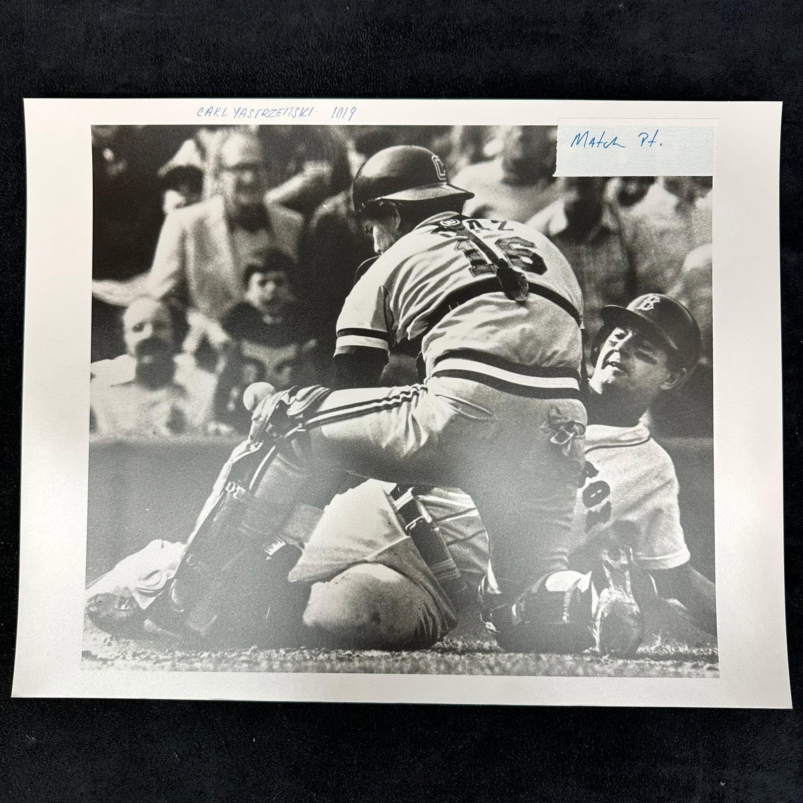 Carl Yastrzemski Boston Red Sox at Home Plate Black and White Silver Gelatin Print: Black and white analog photo print capturing Boston Red Sox legend Carl Yastrzemski in dramatic action at home plate. The image shows Yastrzemski sliding into the catcher in an intense play, highlight
