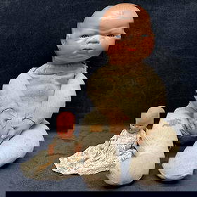 Antique Grace Storey Putnam Bye Lo and Painted Bisque Baby Doll Set Composition Dolls: Each dolls has imperfections light rips and holes, discoloring, minor cracking, and staining. These items are in good pre-owned, previously displayed condition with light wear, and surface scratches.