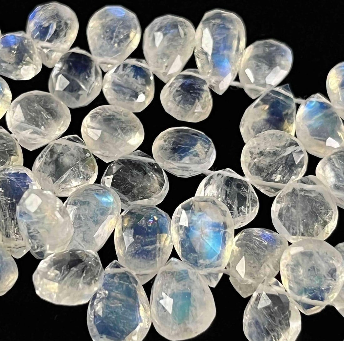 Moonstone 5mm Bead Strands Teardrop Cut Beads (5): Moonstone 5mm Bead Strands Teardrop Cut Beads (5) Here is a lovely lot of rainbow moonstone for that jewelry artist out there. Also, a great set to purchase and have a jeweler design a one-of-a-kind p