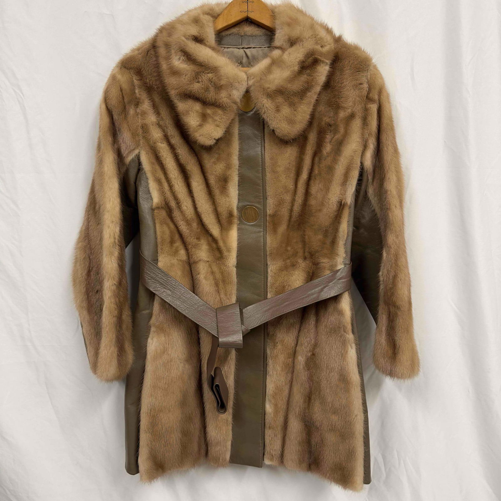 Evans Chicago Natural Pastel Mink Fur Coat Personalized: Evans Chicago Natural Pastel Mink Coat Personalized. Stitched patch KAKP lettering on the right side interior area. This coat features two exterior pockets, three button magnet closures and a belt for