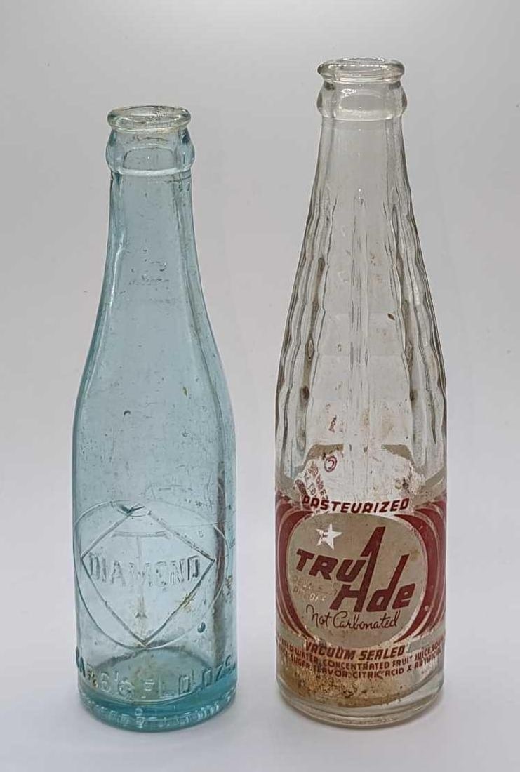 Vintage Tru Ade & Diamond T Glass Bottles: Vintage Tru Ade & Diamond T Glass Bottles. This lot includes: (1) Vintage Tru Ade 7 Oz Glass Bottle. This is approx 2 1/2" x 2 1/2" x 8 5/8". The glass has some inside residue and wea