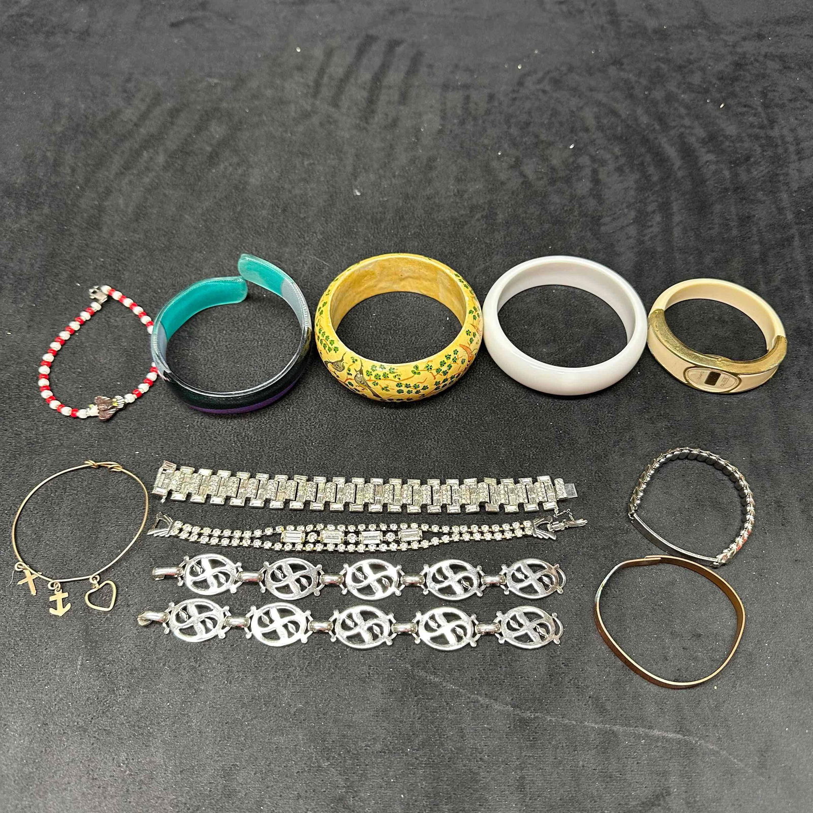 Vintage and Modern Style Bracelet Lot Rhinestone Enamel Beaded Bangle and Charm Bracelets: Assorted lot of vintage and modern costume jewelry bracelets. Includes rhinestone tennis style bracelets, enamel and painted bangles, stretch and beaded designs, charm bracelet with anchor, cross, and