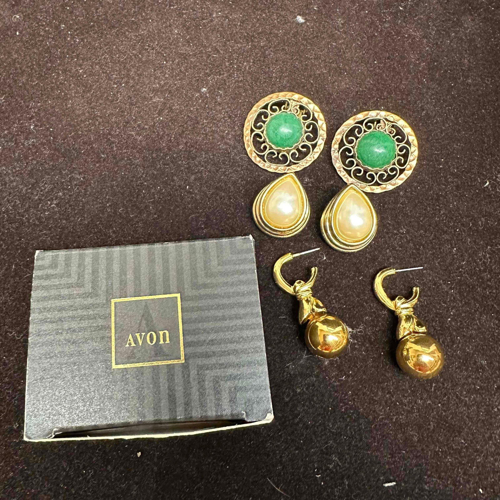 Earrings Avon Gold Dangle Mexico Filigree Green Stone Gold-Toned Faux Pearl Set: Group of vintage costume earrings including: Avon gold tone earrings with original box, a pair of Mexican filigree clip-on earrings with green cabochon centers, and teardrop faux pearl drops pair. The
