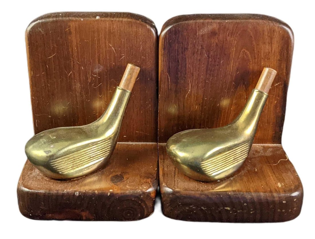 Brass & Wood Golf Club Bookends: Brass & Wood Golf Club Bookends. The maker and date of creation are unknown. Each bookend is approx 6" x 5 1/2" x 7" and together they weigh 3.20lbs. Bookends are in a good, vintage condition with som
