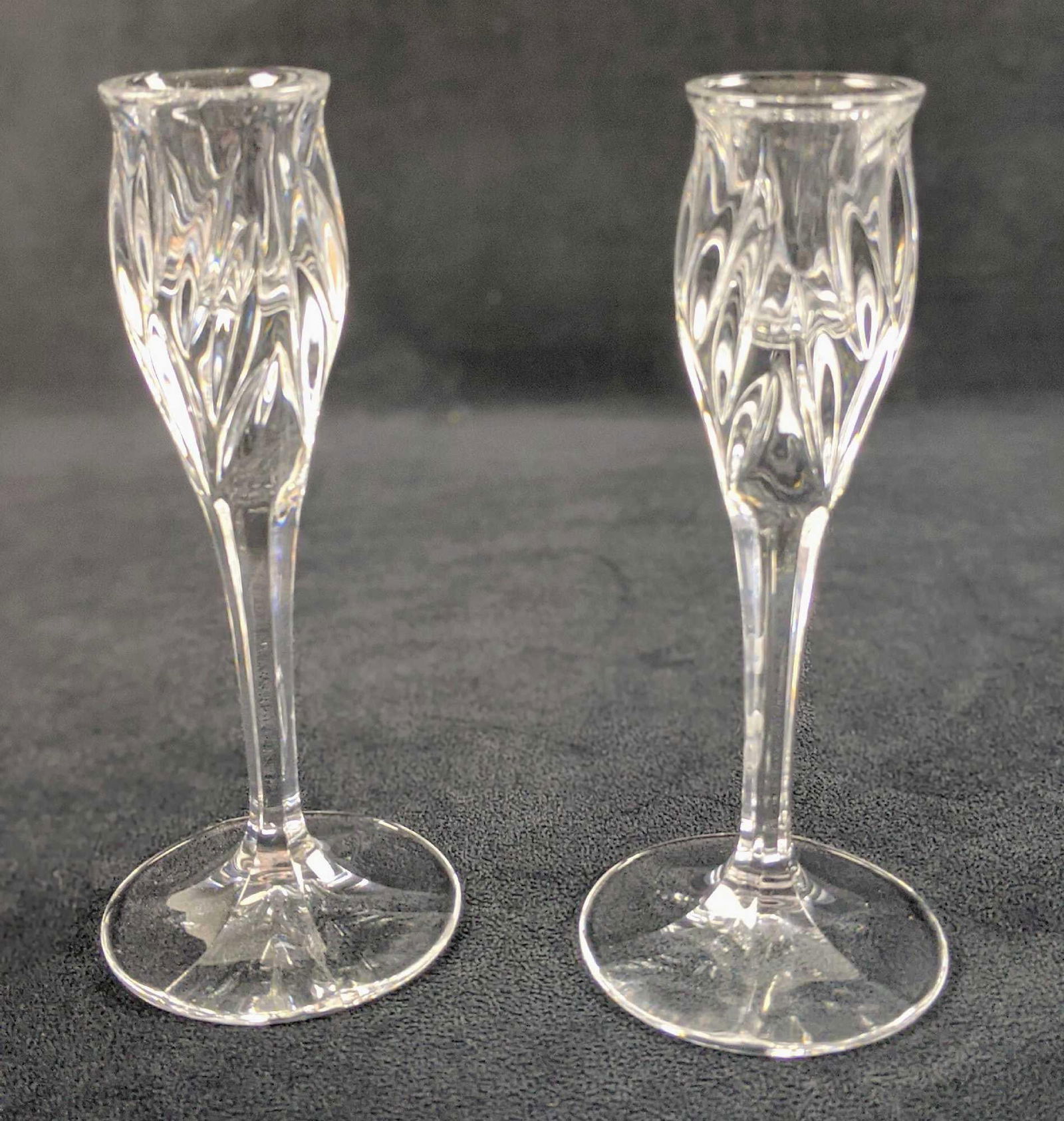 Two Clear Crystal Candlesticks: Two Clear Crystal Candlesticks. The company and date of creation are unknown. Candlesticks are approx 3" x 3" x 7". Candlesticks are in good, unused condition with no known damage.