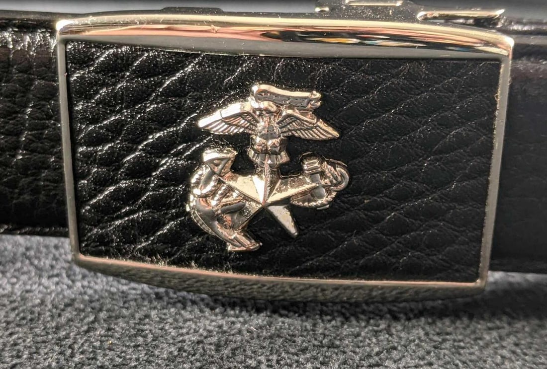Republic of Korea Marine Corps Belt Buckle: Republic of Korea Marine Corps Belt Buckle This is a belt buckle attached to a black leather belt. The belt also has a special hoop that says ROKMC that stands for Republic of Korea Marine Corps. The