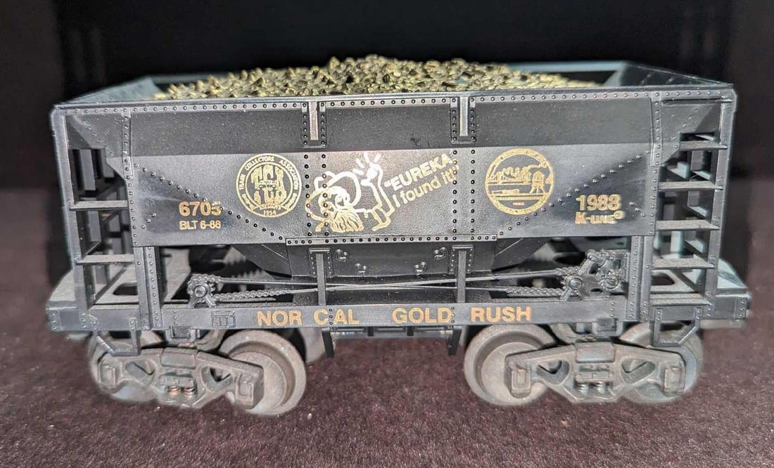 K-Line 1988 TCA National Convention Gold Rush Ore Car: K-Line 1988 TCA National Convention Gold Rush Ore Car. This is approx 7 1/4" x 2 1/2" x 3". It comes in its original box that is approx 10" x 2 7/8" x 4 1/4" and it weighs 0.76