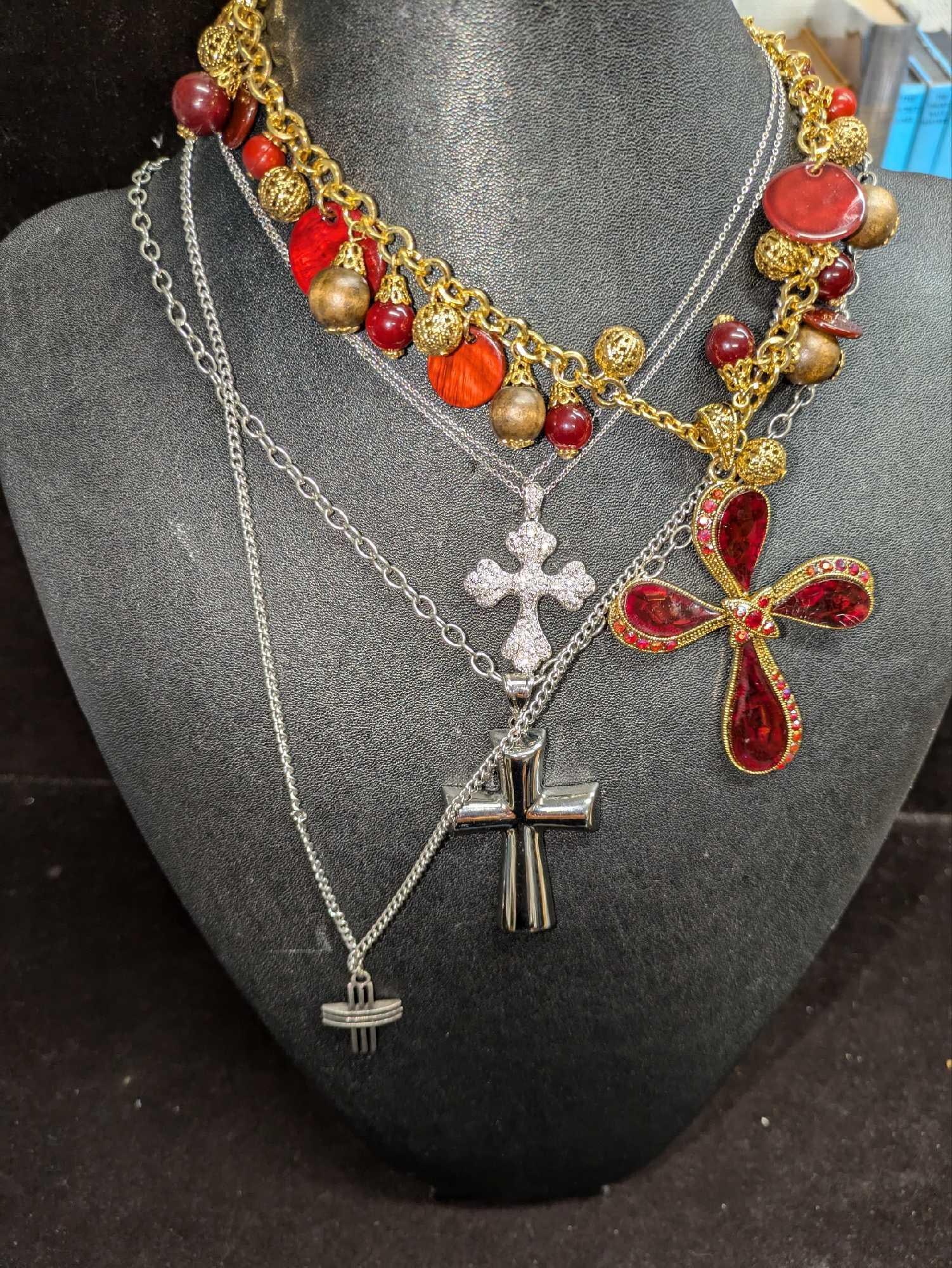 4 Vintage Cross Pendant Necklaces: 4 Vintage Cross Pendant Necklaces. This lot includes: (1) Nadri Double Chain Cross Pendant Necklace. Made of Rhodium. This is approx 16". (1) Silver Tone Curved And Grooved Cross Pendant Necklace